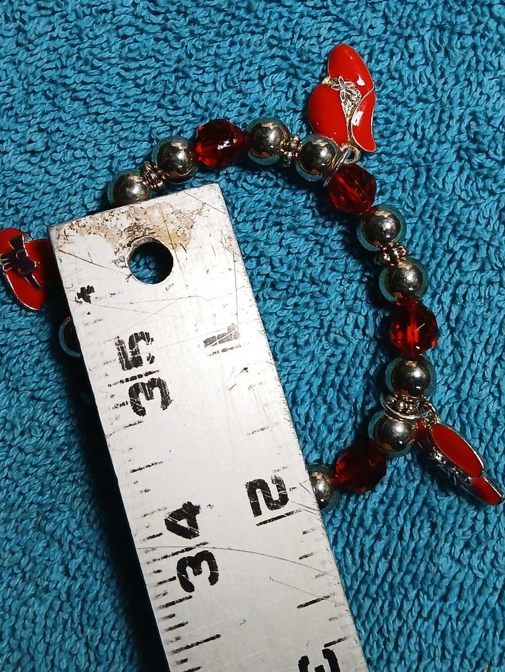 Red Stretch Beaded Bracelet With Red Hats And Silver Accent Beads